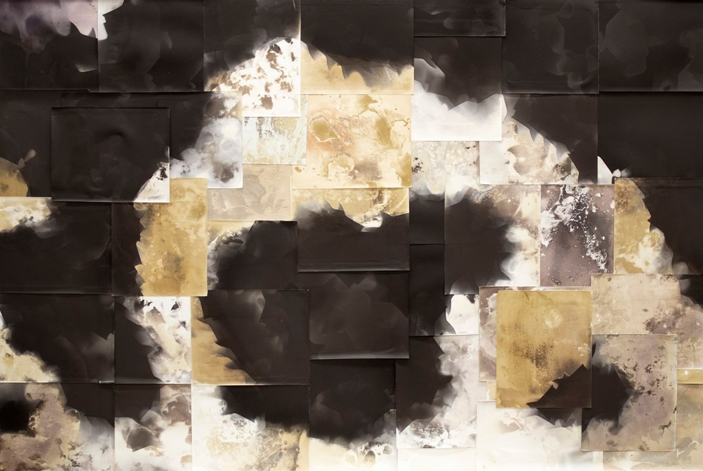 A non-objective abstract artwork with earth-toned textures and a swooping deep black wave arcing around an irregular black, prickly blob.